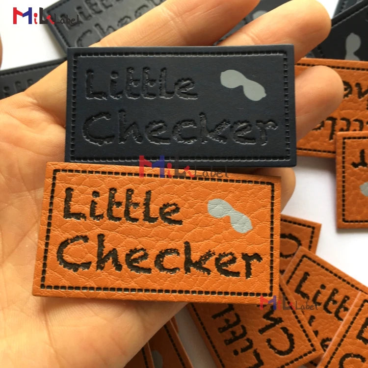 Махсус тери ямоқлари Дебоссед ва ипак экранли босма маркали чарм ямалар Жинслар чарм ёрлиқли дазмол.