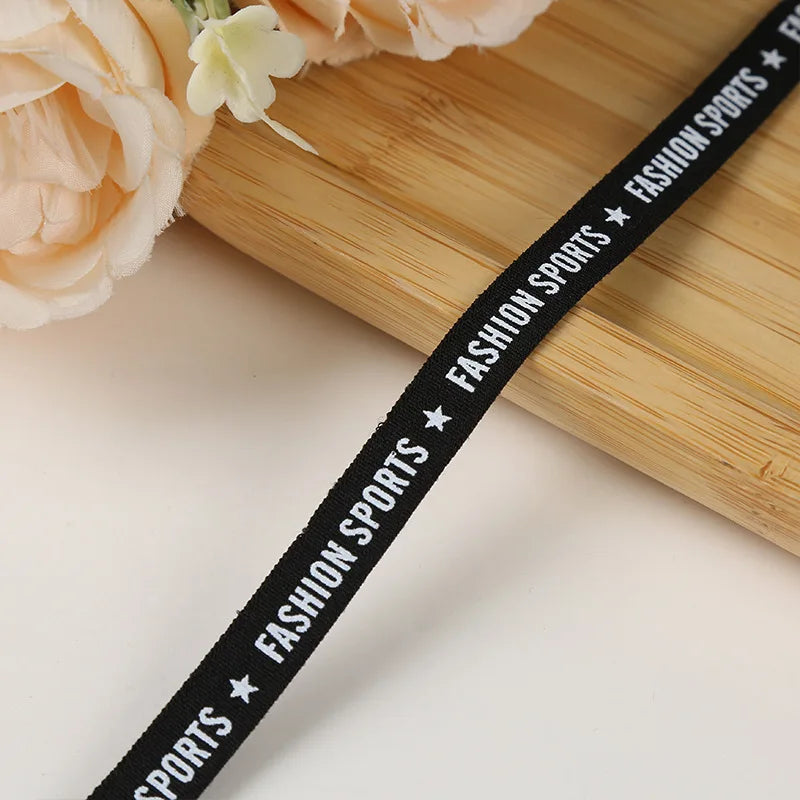 Кучли жаккардли логотипли тасмали нейлон белдаги қора эластик тасма созланиши ранги ва кенглиги билан