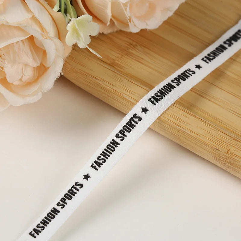 Кучли жаккардли логотипли тасмали нейлон белдаги қора эластик тасма созланиши ранги ва кенглиги билан