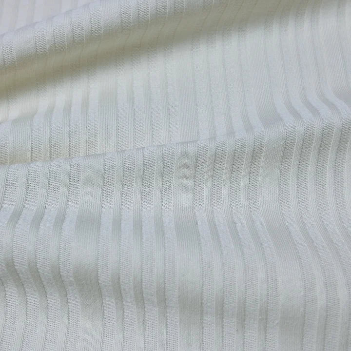 210 г/м² зичликдаги органик 40s рибана жерси мата — 97% пахта ва 3% спандексдан ишланган, юмшоқ, нафас оладиган ва чўзиладиган материал. Футболка ва пижама каби енгил кийимлар учун идеал танлов