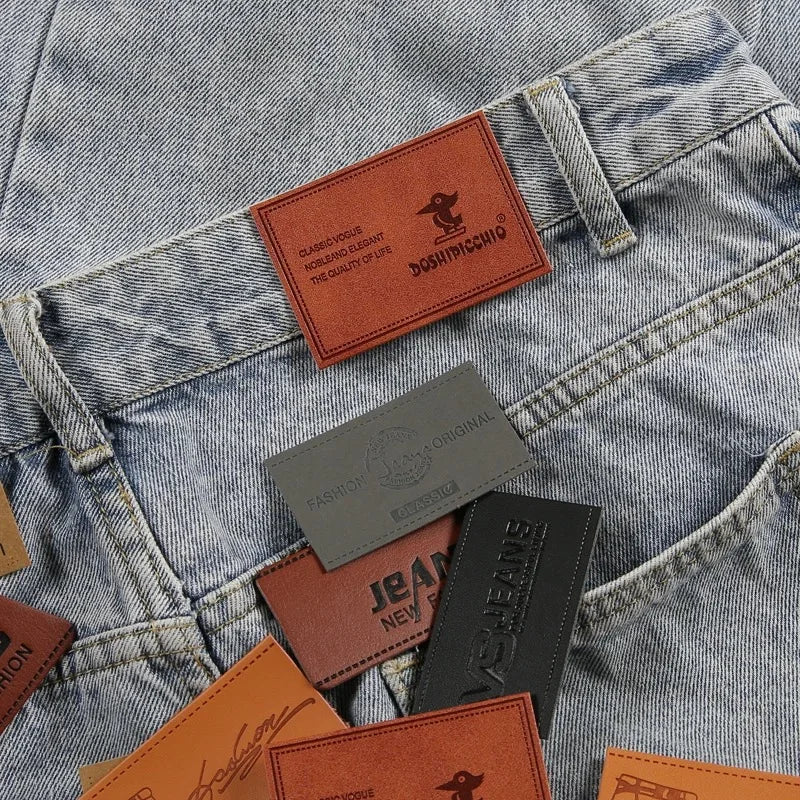 Ямалар улгуржи дизайн Махсус ном логотипи бўртма нақшли ҳақиқий чармдан ясалган ямалар ва сумкалар ва кийимлар учун ёрлиқлар Шляпалар жинси шимлар