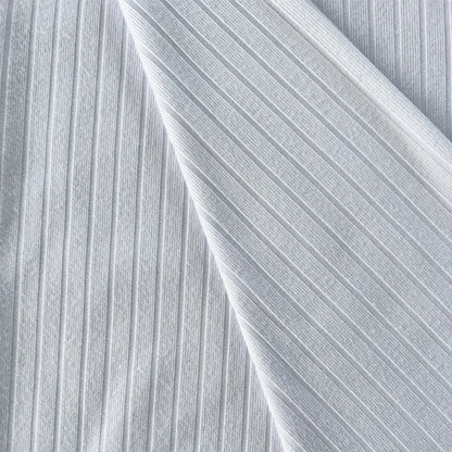 Янги дизайн — 93% полиэстер ва 7% спандексдан тўқилган 8×3 резинка трикотаж мати. Қизлар учун футболка, ички кийим, кўйлак, пижама ва тунги кийимлар тайёрлашга мос, чўзиладиган ва қулай материал